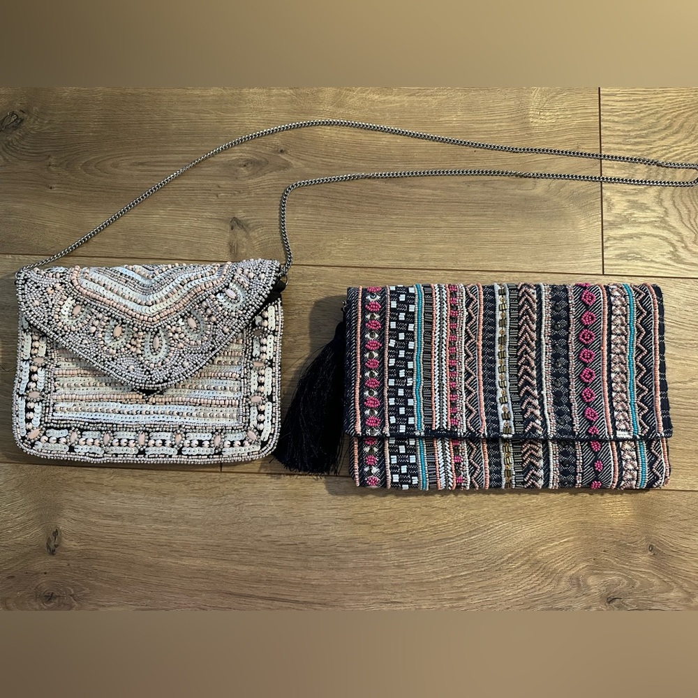 2 beaded handbags both have chain strap.